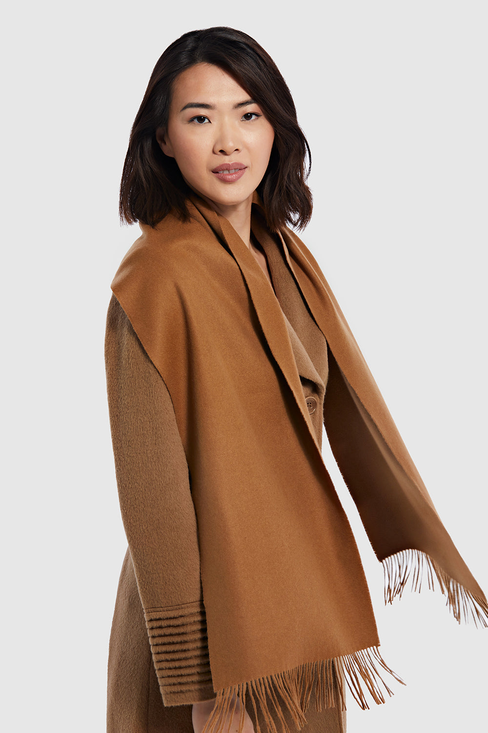 Sentaler SENTALER Vicuña Classic Scarf featured in Vicuña and available in Vicuña. Seen from side with movement.