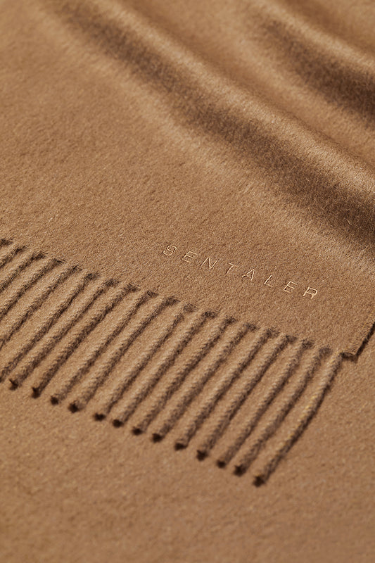 Sentaler Baby Alpaca Classic Scarf crafted in Baby Alpaca and in Dark Camel. Seen as off figure close up.