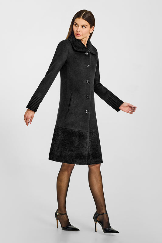 Sentaler A-line Black Coat with Bouclé Alpaca Collar and Trim in Baby Alpaca wool. Seen from side on female model.