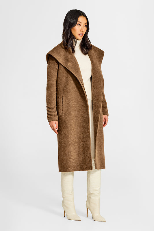 Sentaler Bouclé Alpaca Long Hooded Dark Camel Coat in Bouclé Alpaca wool. Seen from side open on female model.