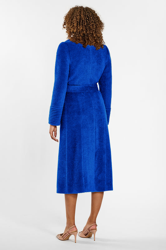 Sentaler Bouclé Alpaca Long Notched Collar Wrap Coat crafted in Bouclé Alpaca wool and in Cobalt Blue. Seen from back belted on female model.