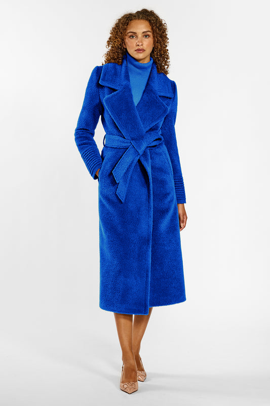 Sentaler Bouclé Alpaca Long Notched Collar Wrap Coat crafted in Bouclé Alpaca wool and in Cobalt Blue. Seen from front belted on female model.