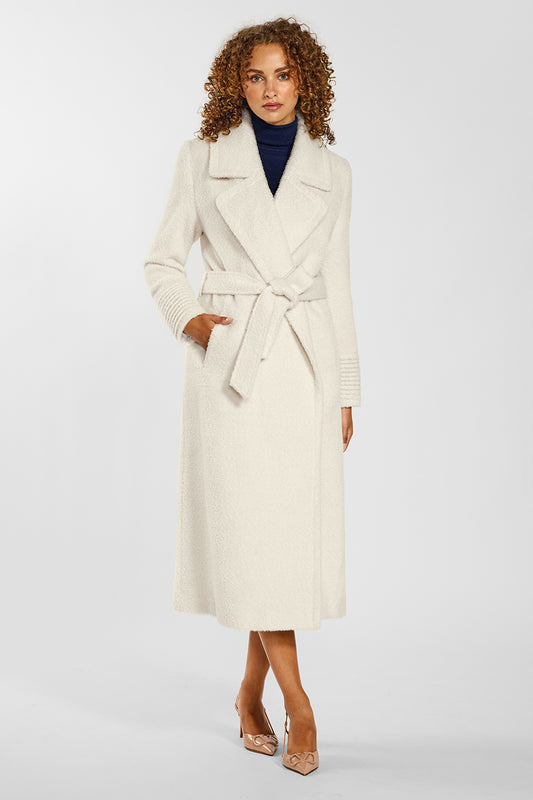 Sentaler Bouclé Alpaca Long Notched Collar Wrap Coat crafted in Bouclé Alpaca wool and in Ivory. Seen from front belted on female model.