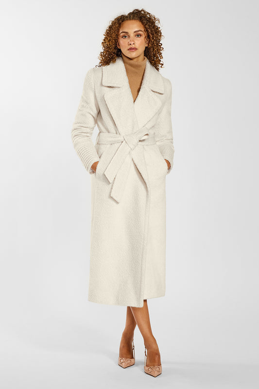 Sentaler Bouclé Alpaca Long Notched Collar Wrap Coat crafted in Bouclé Alpaca wool and in Ivory. Seen from front belted on female model.