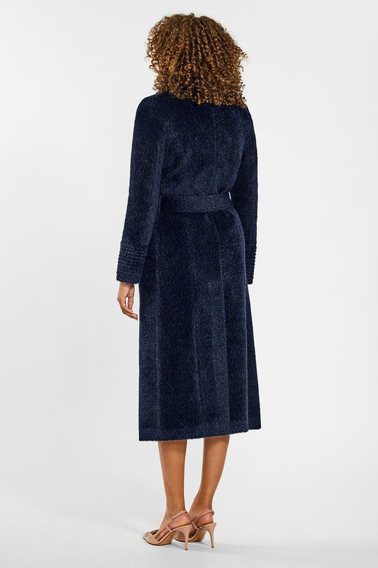 Sentaler Bouclé Alpaca Long Notched Collar Wrap Coat crafted in Bouclé Alpaca wool and in Midnight Blue. Seen from back belted on female model.