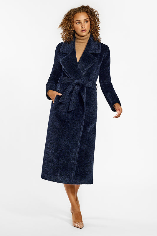 Sentaler Bouclé Alpaca Long Notched Collar Wrap Coat crafted in Bouclé Alpaca wool and in Midnight Blue. Seen from front belted on female model.