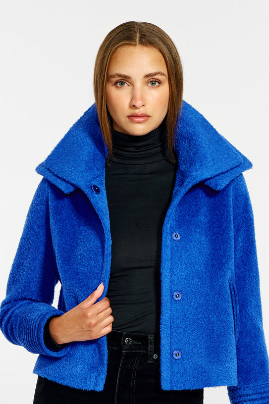 Sentaler Bouclé Alpaca Moto Jacket with Signature Double Collar featured in Bouclé Alpaca and available in Cobalt Blue. Seen from front open close up on female model.