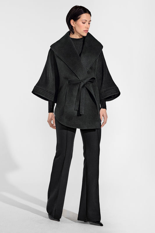 Sentaler Cape with Shawl Collar and Belt featured in Baby Alpaca and available in Black. Seen from front on female model who is wearing the cape belted.