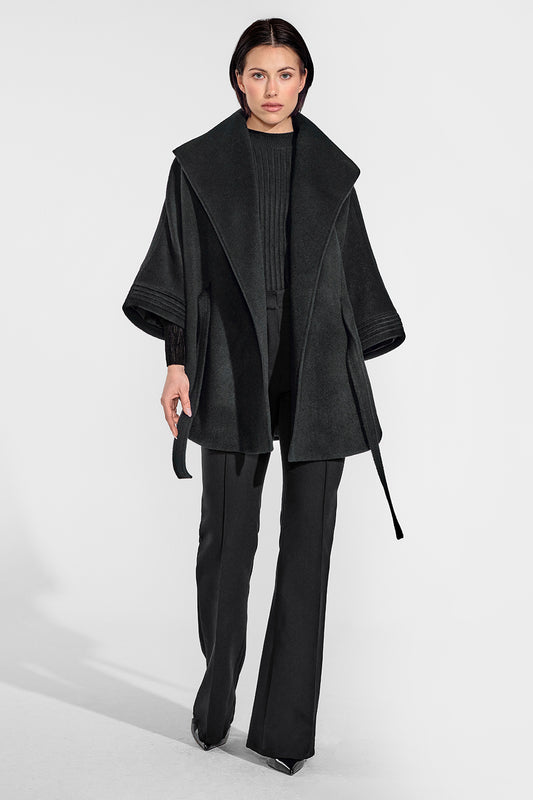 Sentaler Cape with Shawl Collar and Belt featured in Baby Alpaca and available in Black. Seen from front on female model who is wearing the cape open.