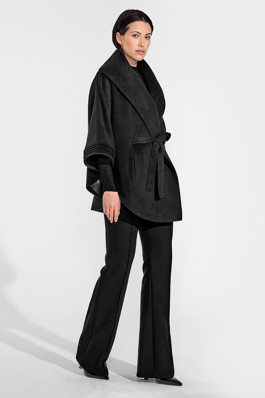 Sentaler Cape with Shawl Collar and Belt featured in Baby Alpaca and available in Black. Seen from side on female model who is wearing the cape belted.