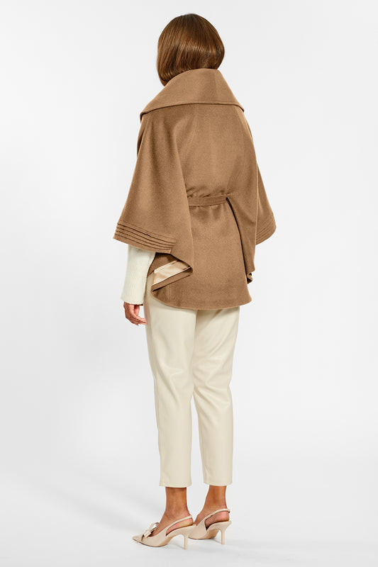 Sentaler Cape with Shawl Collar and Belt crafted in Baby Alpaca wool and in Dark Camel. Seen from back on female model belted.