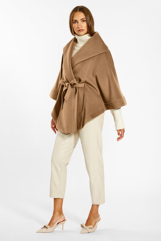 Sentaler Cape with Shawl Collar and Belt crafted in Baby Alpaca wool and in Dark Camel. Seen from side on female model belted.