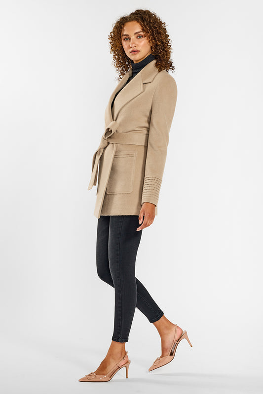 Sentaler Cropped Notched Collar Wrap Coat with Square Pockets crafted in Baby Alpaca and in Camel. Seen from side on female model wearing the coat belted.