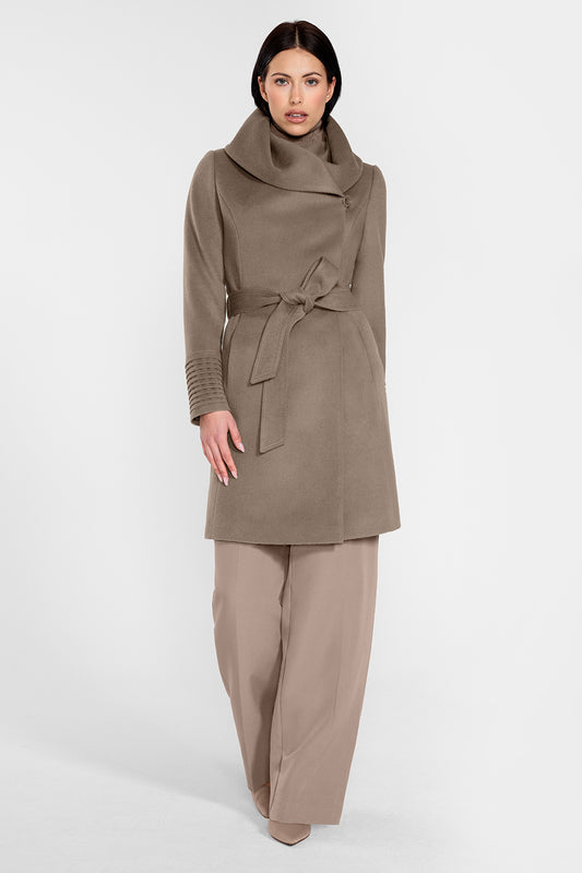 Sentaler Mid Length Hooded Wrap Coat featured in Baby Alpaca and available in Warm Taupe. Seen from front on female model who is wearing the coat belted and buttoned.