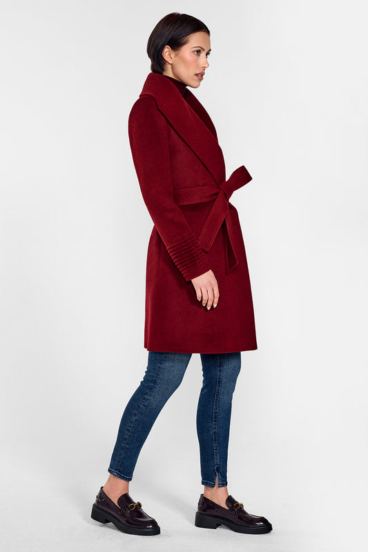 Sentaler Mid Length Shawl Collar Wrap Coat featured in Baby Alpaca and available in Garnet Red. Seen from side on female model who is wearing the coat belted.
