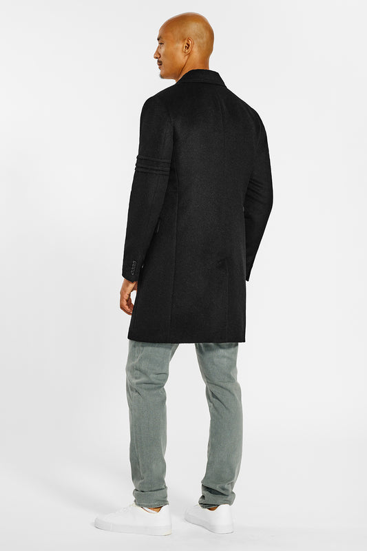 Sentaler Technical Baby Alpaca Notched Lapel Overcoat crafted in Technical Baby Alpaca and available in Black. Seen from back on male model.