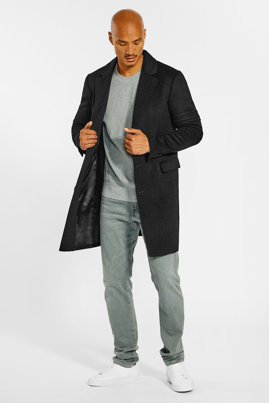 Sentaler Technical Baby Alpaca Notched Lapel Overcoat crafted in Technical Baby Alpaca and available in Black. Seen from front open on male model.