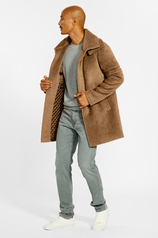 Sentaler Technical Bouclé Alpaca Double Collar Topcoat crafted in Technical Bouclé Alpaca and available in Dark Camel. Seen from side open on male model.