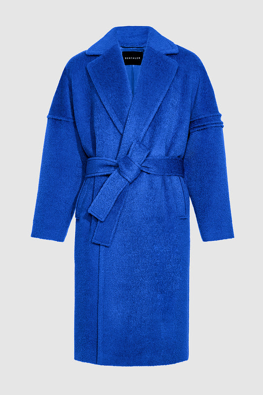 Sentaler Technical Bouclé Alpaca Robe Coat crafted in Technical Bouclé Alpaca and available in Cobalt Blue. Seen as off figure belted.
