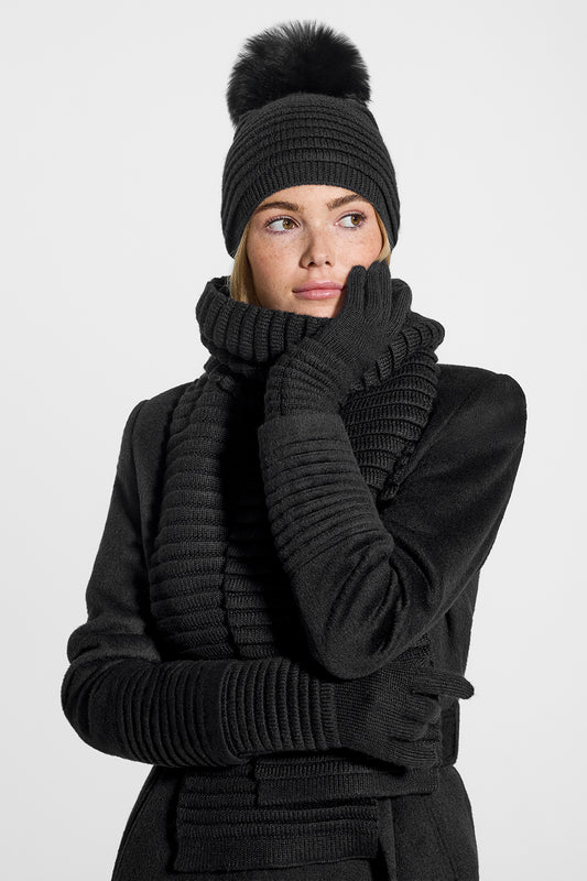 Sentaler Adult Ribbed Scarf, Adult Ribbed Scarf and Adult Ribbed Gloves featured in Baby Alpaca and available in Black. Seen from front on model.