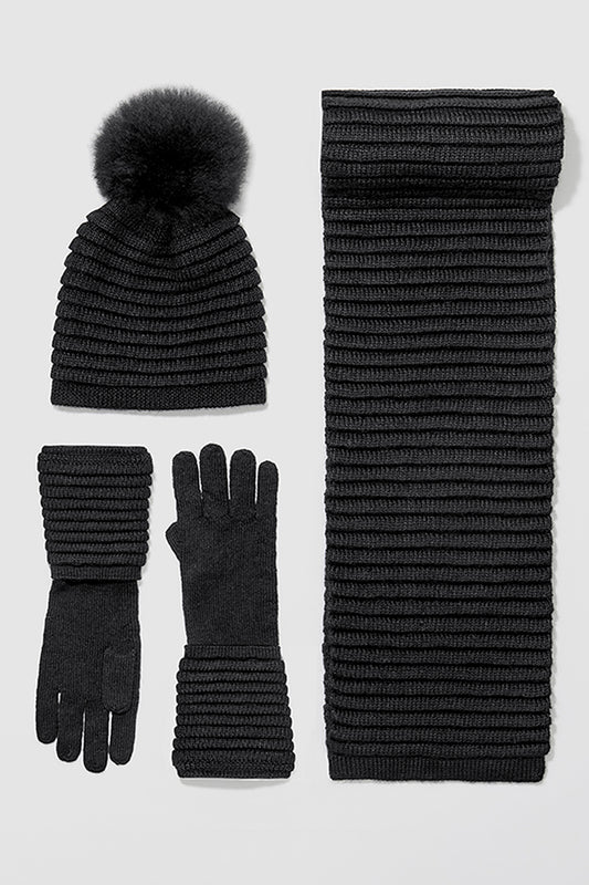 Sentaler Adult Ribbed Gloves, Adult Ribbed Hat with Oversized Fur Pompon, Adult Ribbed Scarf featured in Baby Alpaca and available in Black. Seen as off figures.