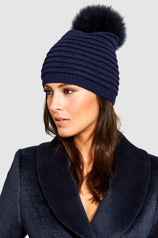 Sentaler Adult Ribbed Hat With Oversized Fur Pompon featured in Baby Alpaca and available in Navy. Seen from front 3.