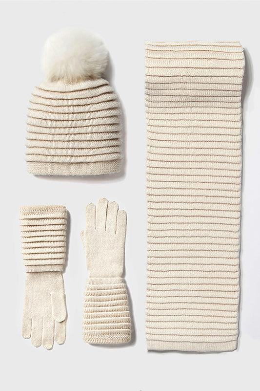Sentaler Adult Ribbed Gloves, Ribbed Hat with Oversized Fur Pompon and Ribbed Gloves featured in Baby Alpaca and available in Ivory. Seen as off figures.