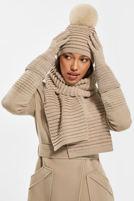 Sentaler Adult Ribbed Scarf, Ribbed Hat with Oversized Fur Pompon featured in Baby Alpaca and available in Camel. Seen from front on model.