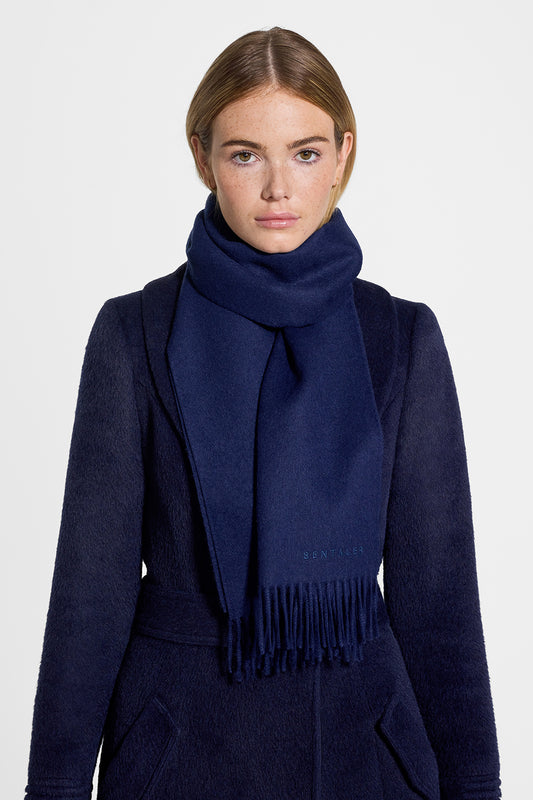 Sentaler Baby Alpaca Classic Scarf featured in Baby Alpaca and available in Navy. Seen from front on model.