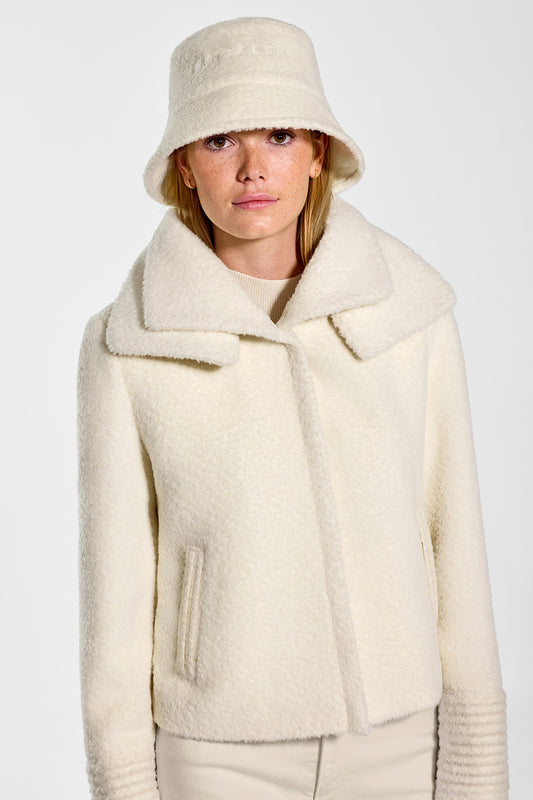 Sentaler Baby Alpaca Classic Scarf featured in Baby Alpaca and available in Ivory. Seen from front close up on model.