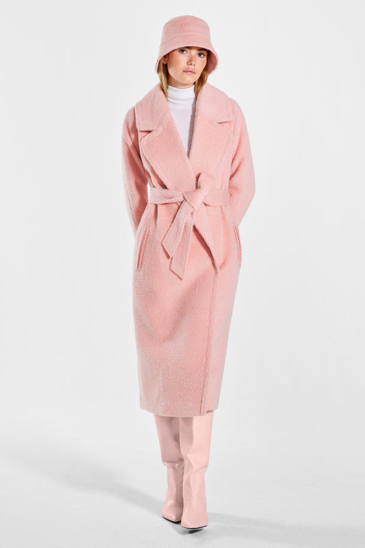 Sentaler Bouclé Alpaca Bucket Hat featured in Bouclé Alpaca and available in Pink Clay. Seen from front on model.