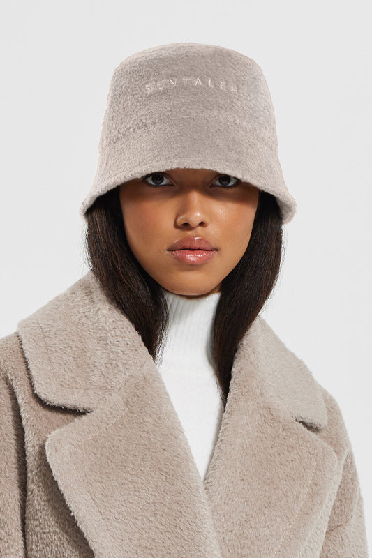 Sentaler Bouclé Alpaca Bucket Hat featured in Bouclé Alpaca and available in Sand. Seen from front close up.