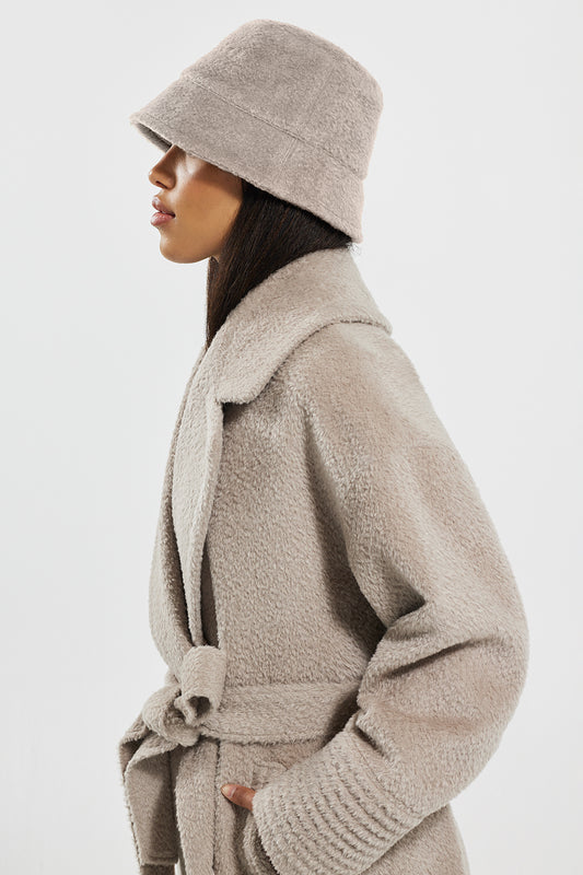 Sentaler Bouclé Alpaca Bucket Hat featured in Bouclé Alpaca and available in Sand. Seen from side close up.