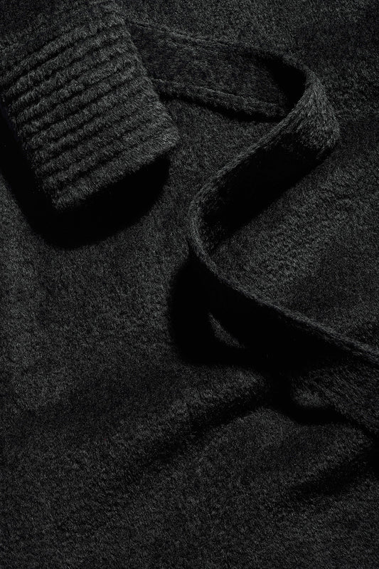 Sentaler Bouclé Alpaca Long Notched Collar Wrap Coat featured in Bouclé Alpaca and available in Black. Seen fabric close up as off figure.