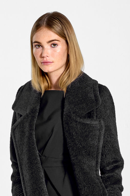 Sentaler Bouclé Alpaca Long Notched Collar Wrap Coat featured in Bouclé Alpaca and available in Black. Seen from side open close up on model.