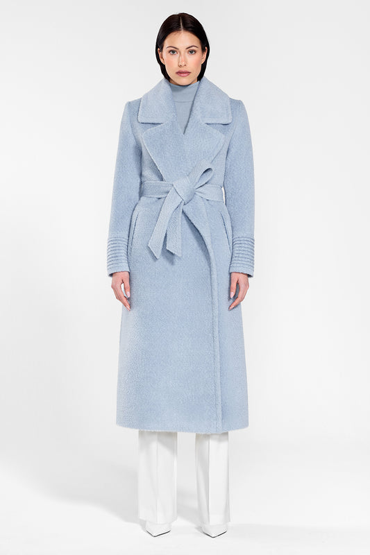 Sentaler Bouclé Alpaca Long Notched Collar Wrap Coat featured in Bouclé Alpaca and available in Powder Blue. Seen from front on female model wearing the coat belted.