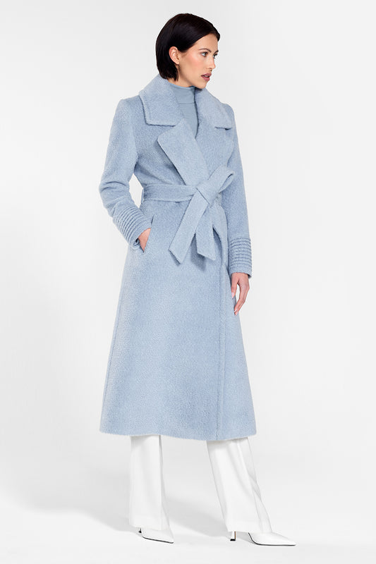Sentaler Bouclé Alpaca Long Notched Collar Wrap Coat featured in Bouclé Alpaca and available in Powder Blue. Seen from side on female model wearing the coat belted.