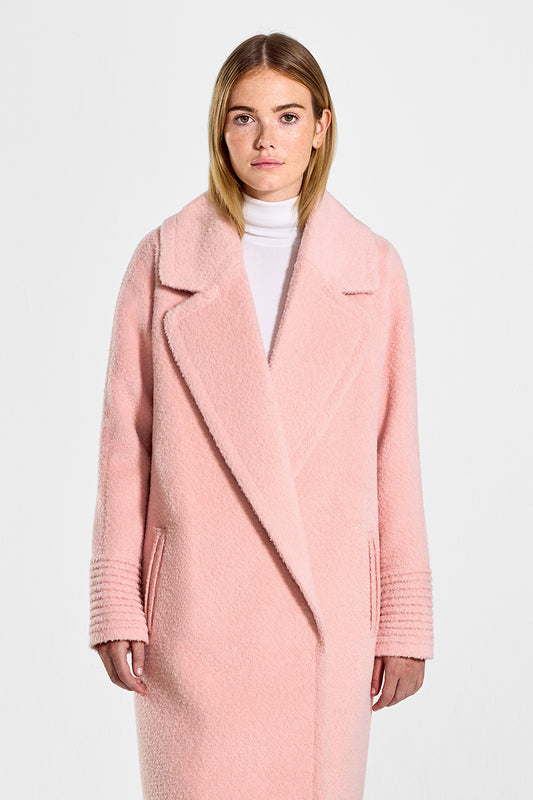 Sentaler Bouclé Alpaca Long Raglan Sleeve Notched Collar Coat featured in Bouclé Alpaca and available in Pink Clay. Seen from front above the knees on model. 