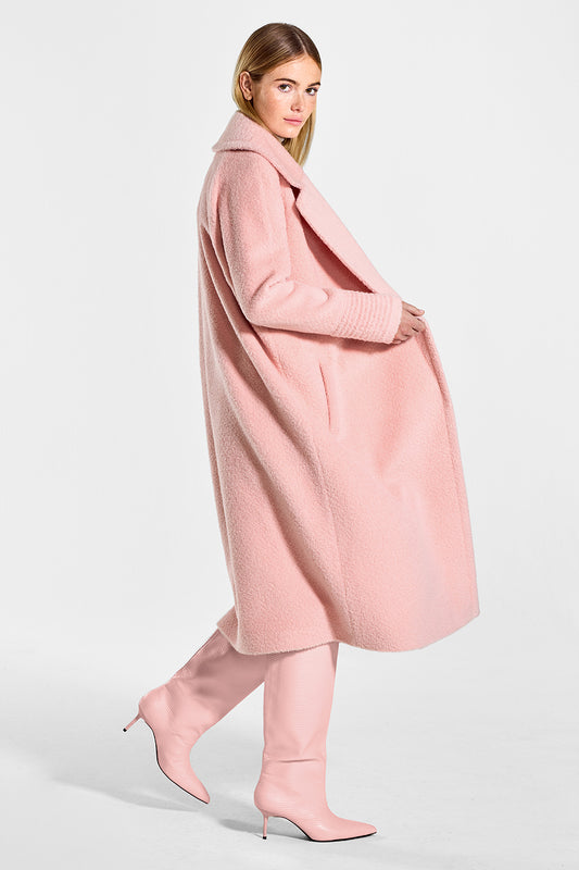 Sentaler Bouclé Alpaca Long Raglan Sleeve Notched Collar Coat featured in Bouclé Alpaca and available in Pink Clay. Seen from side open on model.