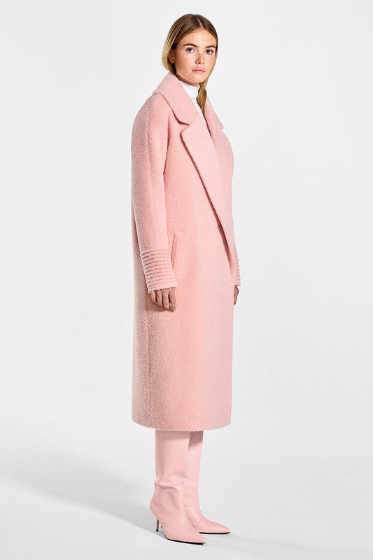 Sentaler Bouclé Alpaca Long Raglan Sleeve Notched Collar Coat featured in Bouclé Alpaca and available in Pink Clay. Seen from side on model.