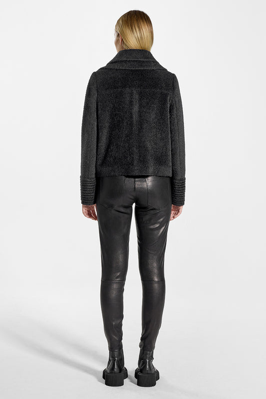 Sentaler Bouclé Alpaca Moto Jacket with Signature Double Collar featured in Bouclé Alpaca and available in Black. Seen from back on model.