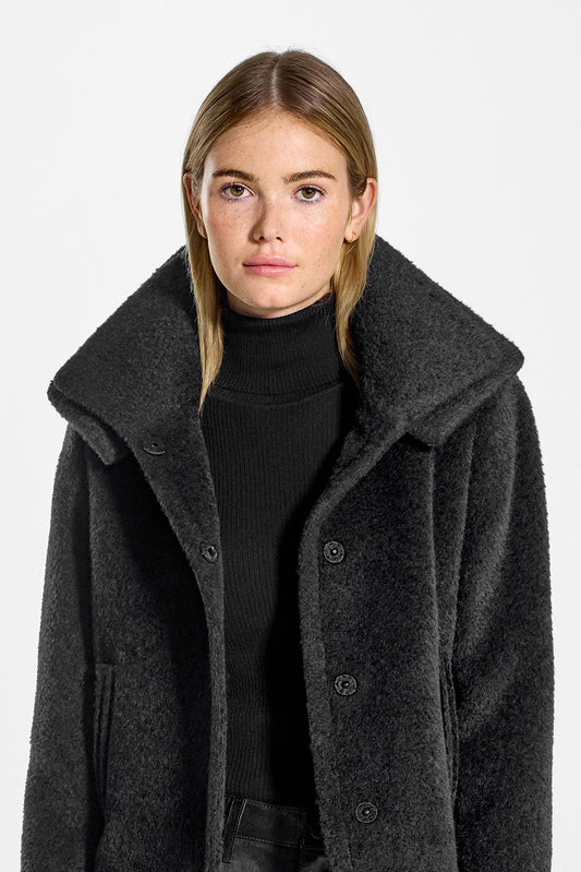 Sentaler Bouclé Alpaca Moto Jacket with Signature Double Collar featured in Bouclé Alpaca and available in Black. Seen from front open close up on model.