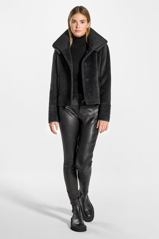 Sentaler Bouclé Alpaca Moto Jacket with Signature Double Collar featured in Bouclé Alpaca and available in Black. Seen from front open on model.