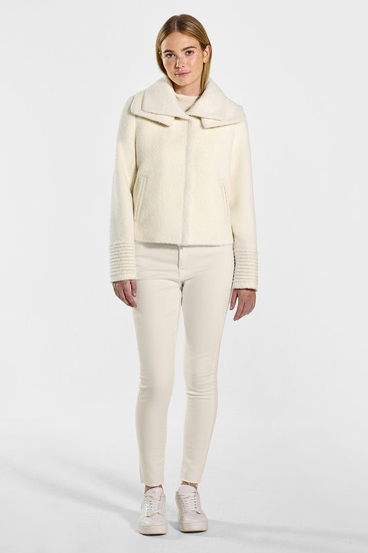 Sentaler Bouclé Alpaca Moto Jacket with Signature Double Collar featured in Bouclé Alpaca and available in Ivory. Seen from front on model.