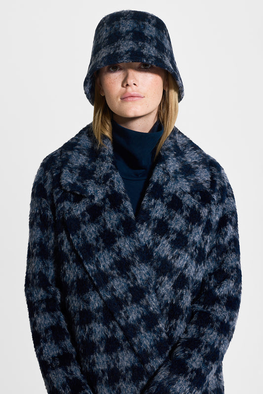 Sentaler Houndstooth Alpaca Long Raglan Sleeve Notched Collar Coat and Houndstooth Suri Bucket Hat featured in Printed Suri Alpaca and available in Navy Houndstooth. Seen from front close up on model.