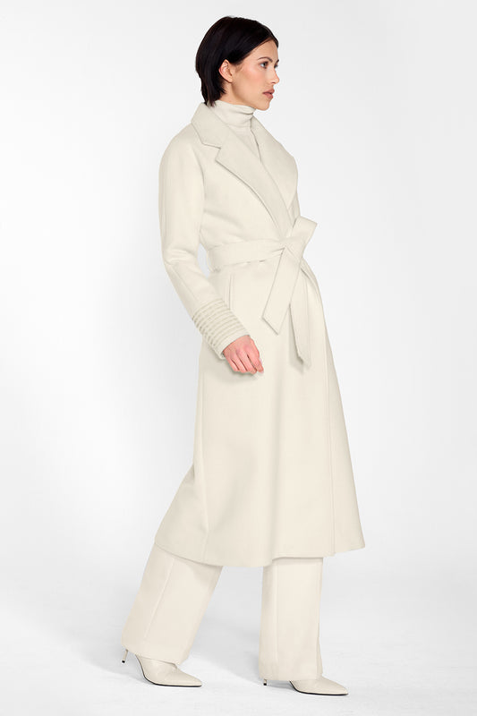 Sentaler Long Notched Collar Raglan Sleeve Wrap Coat and Baby Alpaca Classic Scarf featured in Baby Alpaca and available in Ivory. Seen from side on female model who is wearing the coat belted.