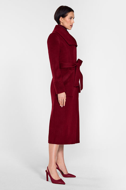 Sentaler Long Wide Collar Wrap Coat featured in Baby Alpaca and available in Garnet Red. Seen from side on female model who is wearing the coat belted.