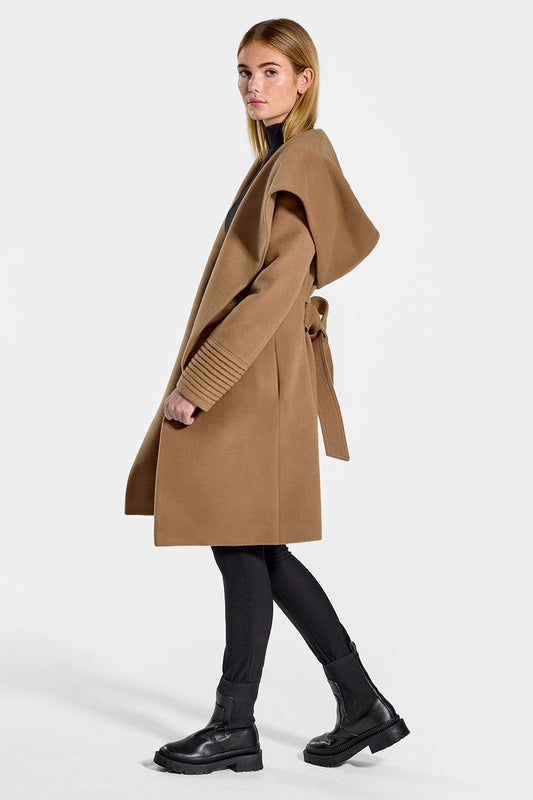Sentaler Mid Length Hooded Wrap Coat featured in Baby Alpaca and available in Dark Camel. Seen from side open on model.
