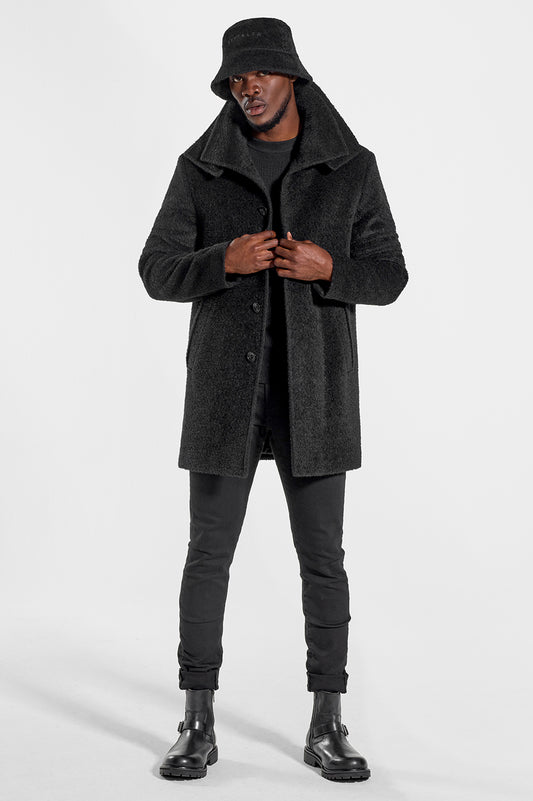 Sentaler Technical Baby Alpaca Notched Lapel Overcoat and Bouclé Alpaca Bucket Hat featured in Technical Baby Alpaca and available in Black. Seen from front open.
