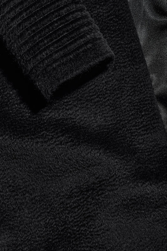 Sentaler Suri Alpaca Long Shawl Collar Wrap Coat with Ribbed Sleeves featured in Suri Alpaca and available in Black. Seen fabric up close.